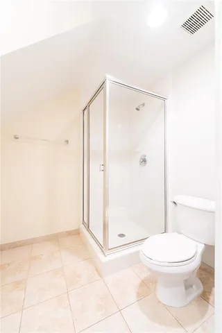 a spacious bathroom with a granite countertop sink and a mirror