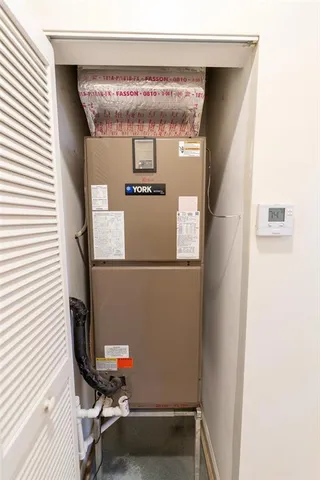 a spacious bathroom with a granite countertop sink and a mirror