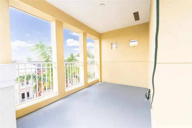 a view of an empty room and a window