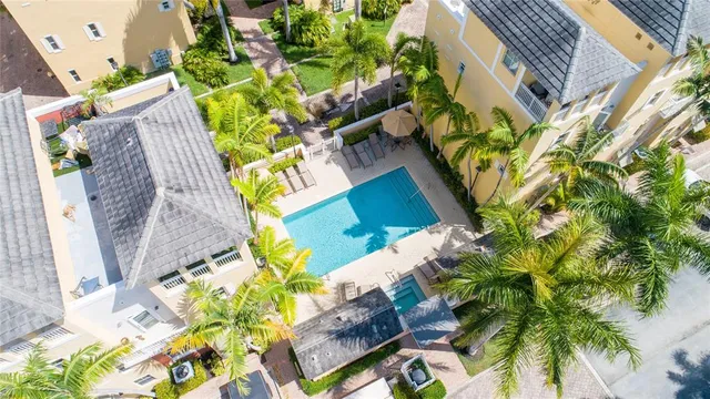 an aerial view of a house with a yard and garden