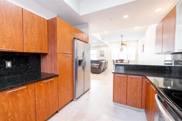 a kitchen with stainless steel appliances a sink cabinets and a counter top space