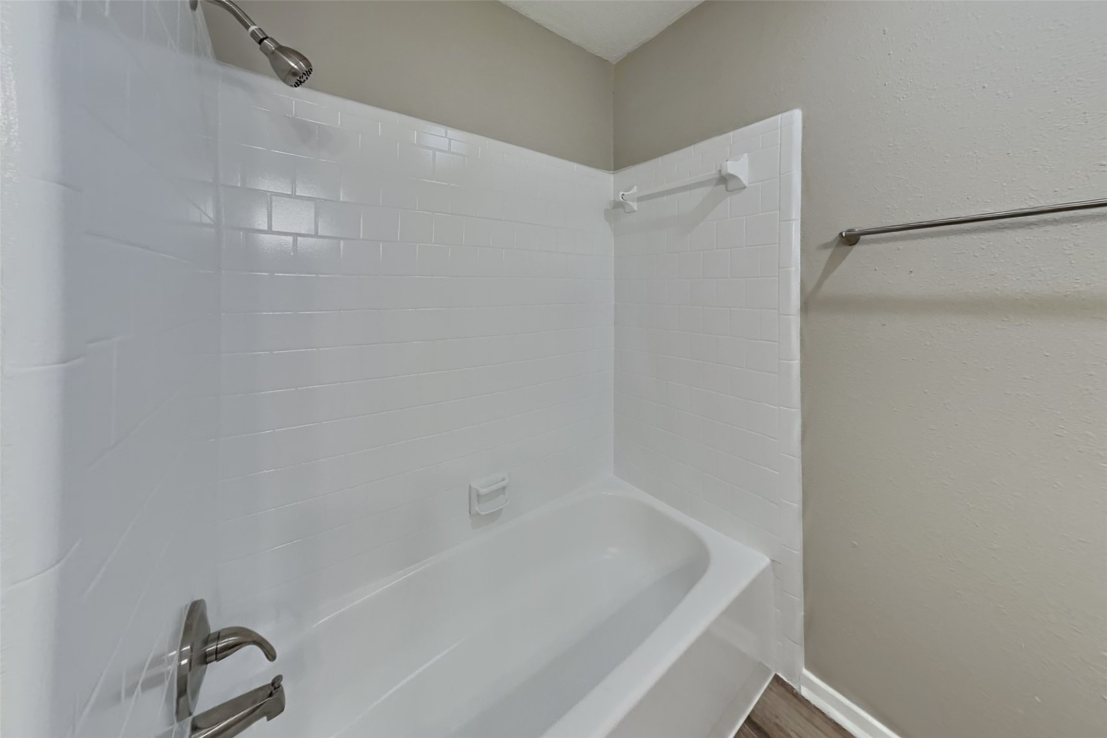 10015 Rippling Fields Drive Houston, TX 77064 - Photo 20 of 24 a bathroom with a bathtub