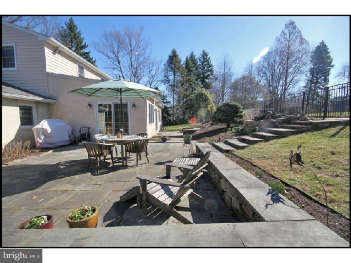 1028 Millbrook Road Berwyn, PA 19312 - Photo 23 of 25 a view of a patio with table and chairs with wooden floor and fence