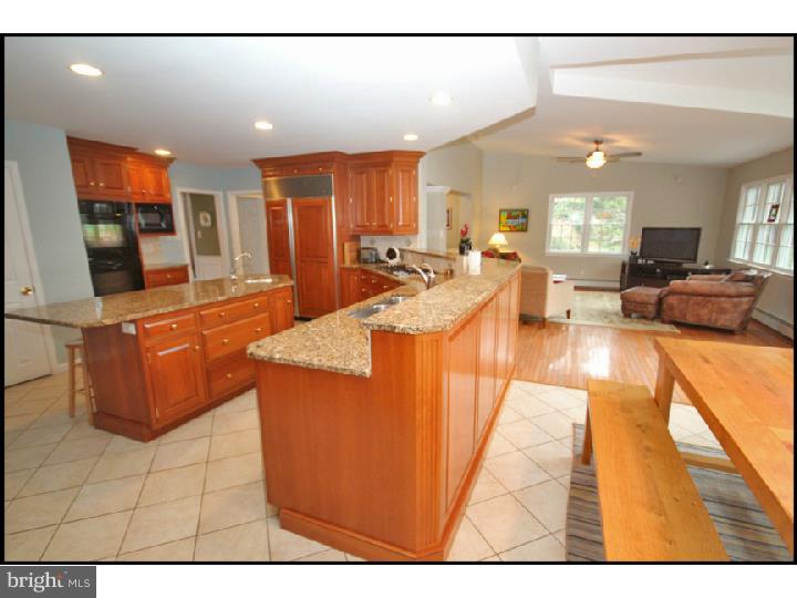 1028 Millbrook Road Berwyn, PA 19312 - Photo 9 of 25 a view of a living room and kitchen