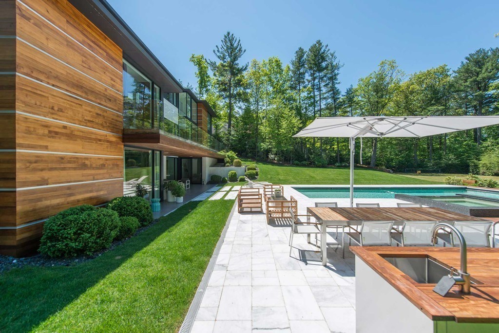 63 Westcliff Road Weston, MA 02493 - Photo 12 of 30 a view of backyard with swimming pool and outdoor seating