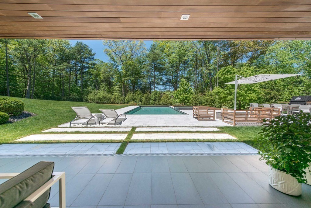 63 Westcliff Road Weston, MA 02493 - Photo 5 of 30 a view of swimming pool from a yard