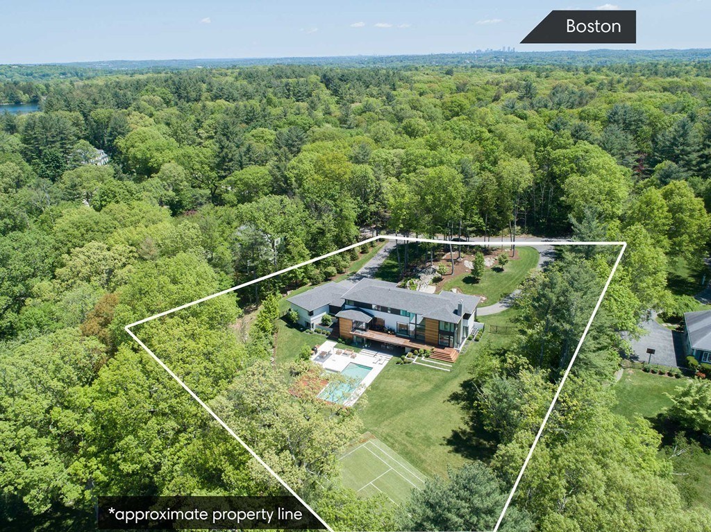 63 Westcliff Road Weston, MA 02493 - Photo 8 of 30 a view of a yard with a wooden deck