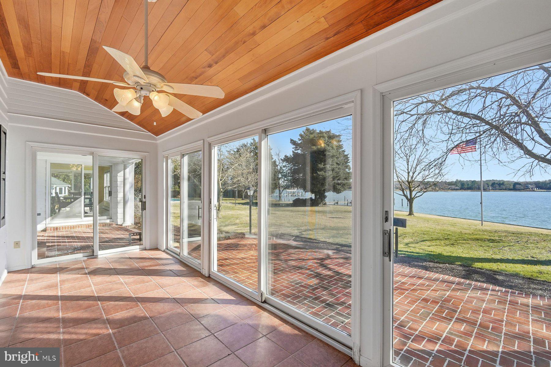 8515 Deep Cove Road Easton, MD 21601 - Photo 16 of 55 a room with a floor to ceiling windows and pool table
