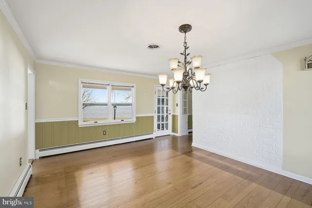 a kitchen with a sink window and cabinets