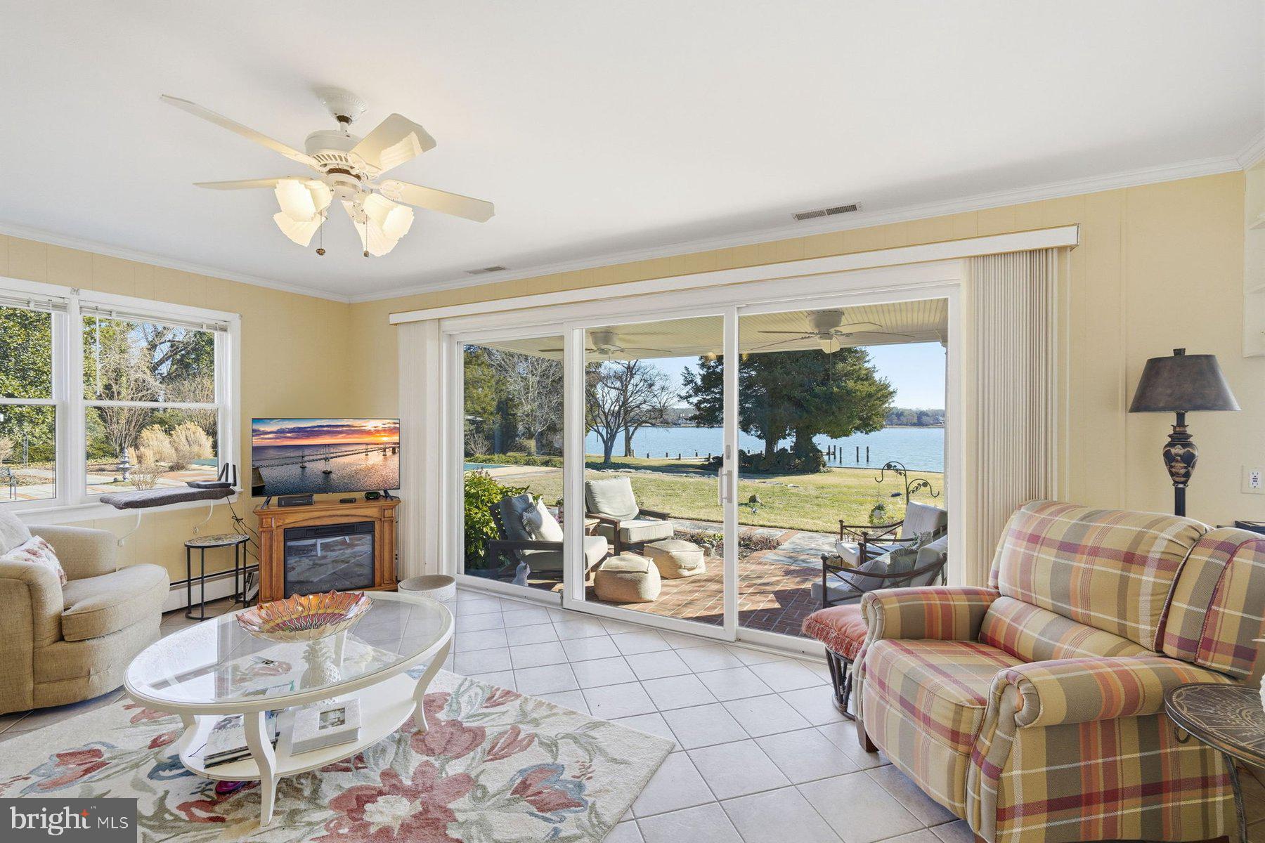 8515 Deep Cove Road Easton, MD 21601 - Photo 25 of 55 a living room with furniture and a large window