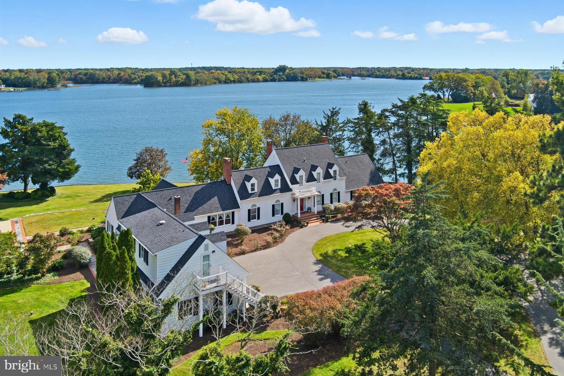 8515 Deep Cove Road Easton, MD 21601 - Photo 3 of 55 an aerial view of a house with outdoor space and lake view