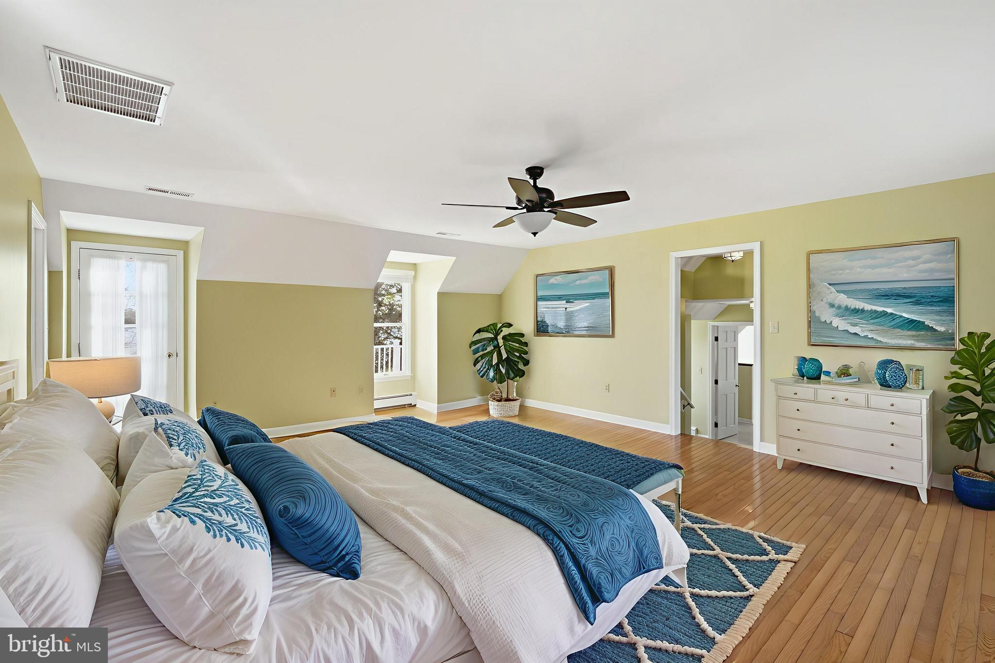 8515 Deep Cove Road Easton, MD 21601 - Photo 35 of 55 a bedroom with a bed and wooden floor
