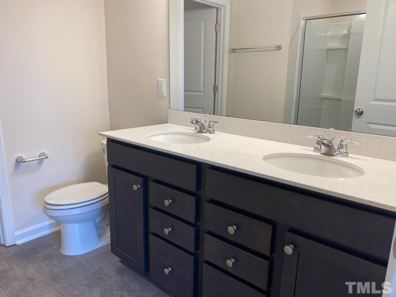 407 Vassar Drive Durham, NC 27713 - Photo 5 of 9 a bathroom with a sink and a toilet