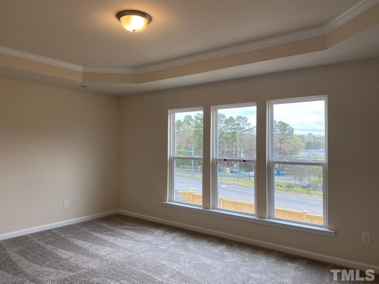 407 Vassar Drive Durham, NC 27713 - Photo 6 of 9 an empty room with a window