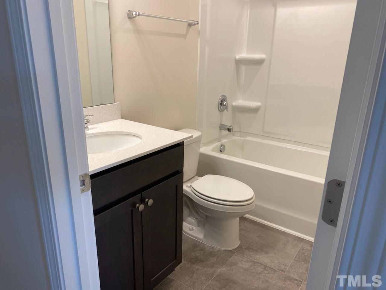 407 Vassar Drive Durham, NC 27713 - Photo 7 of 9 a bathroom with a sink a toilet and bathtub