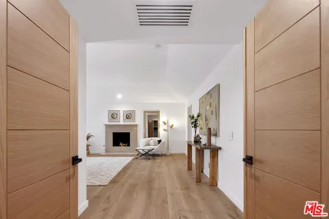 a view of a livingroom with furniture and a fireplace