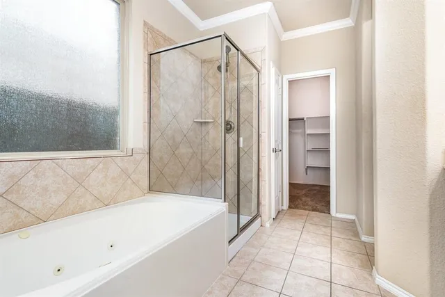 a view of a livingroom with a ceiling fan and window