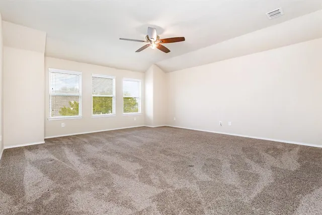 a view of workspace with wooden floor and windows