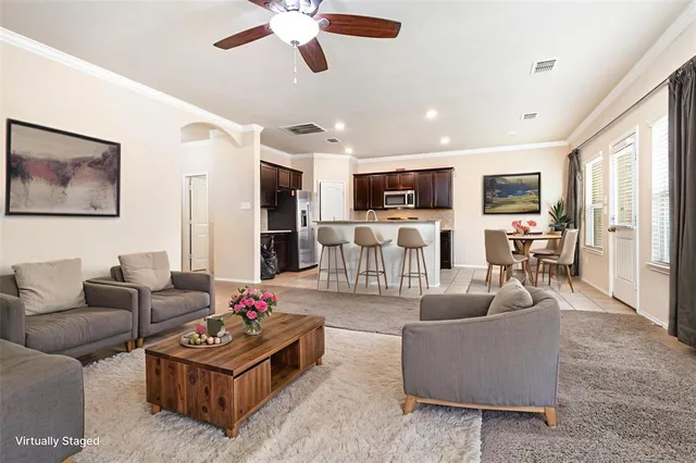 a kitchen with stainless steel appliances granite countertop a sink and a refrigerator