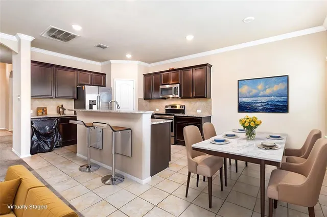 a bathroom with a sink double vanity and a mirror