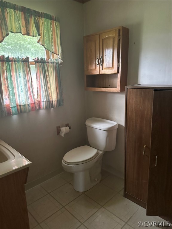 1227 Salisbury Drive Midlothian, VA 23113 - Photo 9 of 12 a bathroom with a toilet sink and window