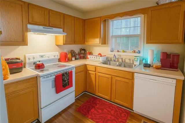 a utility room with cabinets a washer and dryer