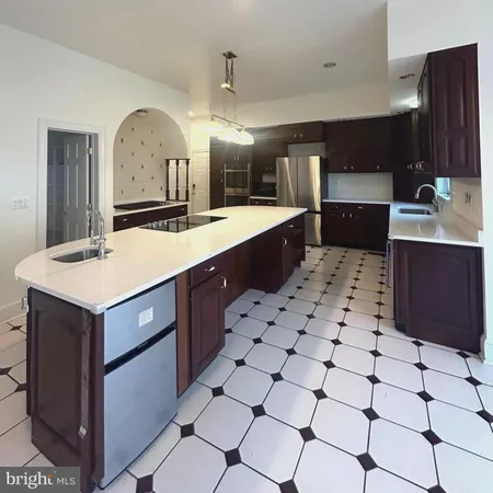 a kitchen with stainless steel appliances granite countertop a sink and a cabinets