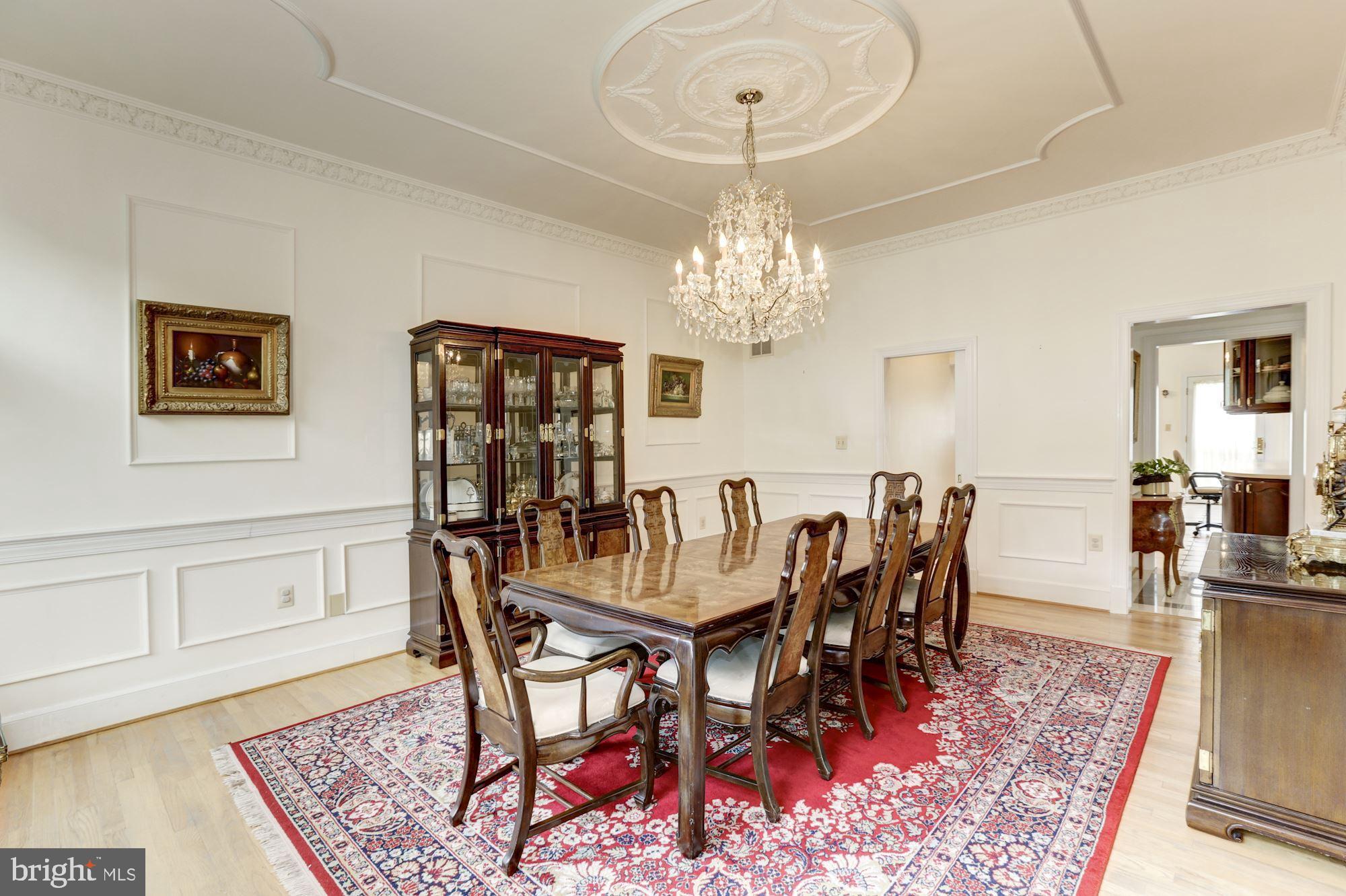 914 Helga Place McLean, VA 22102 - Photo 20 of 72 a view of a dining room with furniture and chandelier