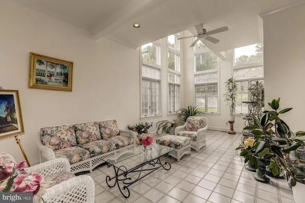 a living room with furniture a fireplace and a rug