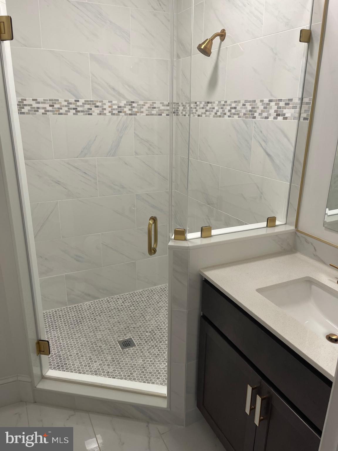 914 Helga Place McLean, VA 22102 - Photo 44 of 72 a bathroom with a shower and vanity