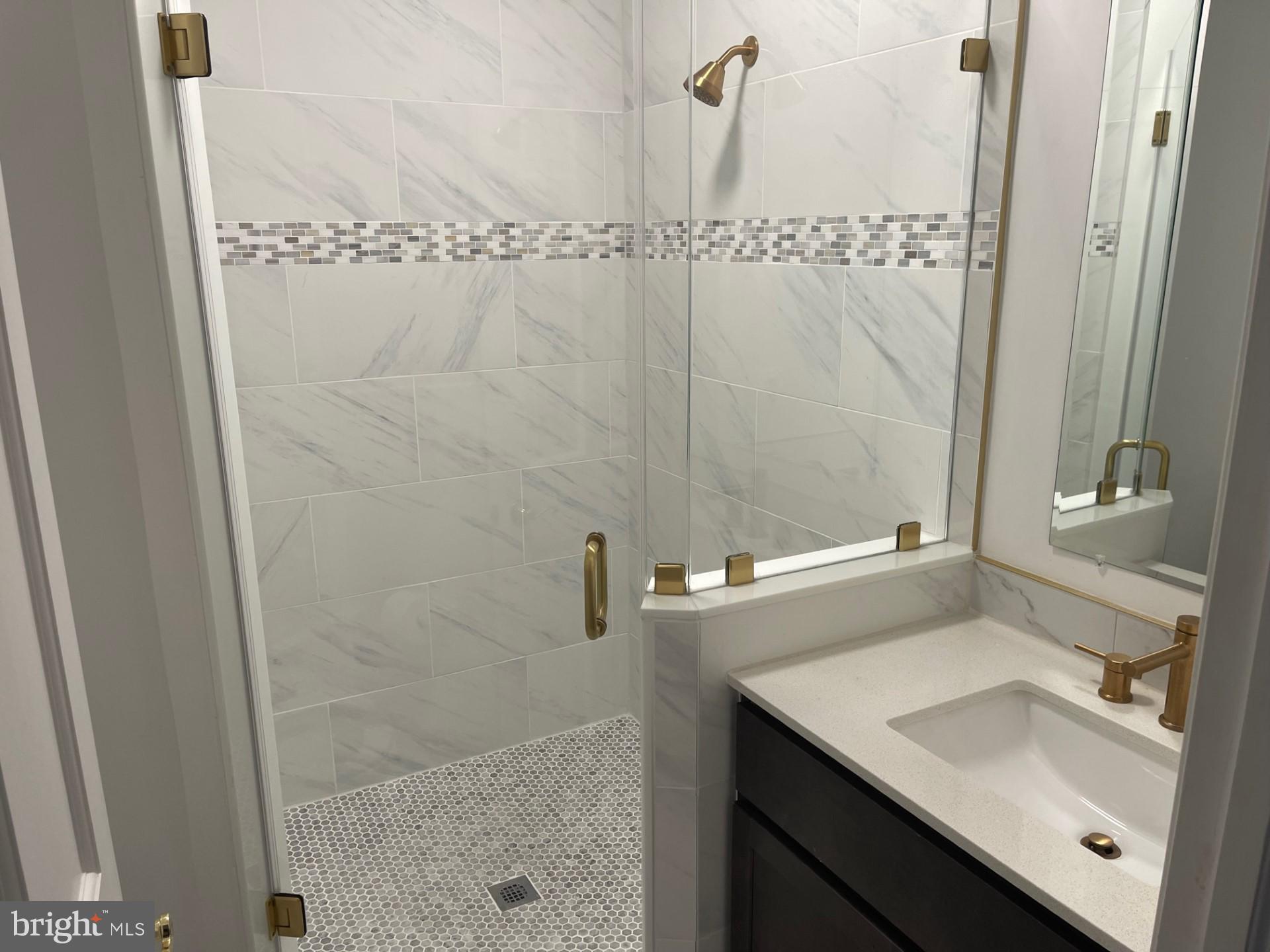 914 Helga Place McLean, VA 22102 - Photo 45 of 72 a bathroom with a sink and a mirror