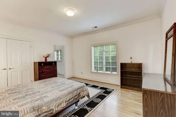 a view of a kitchen with furniture and white walls