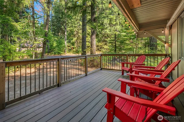 a view of a two chairs in the balcony