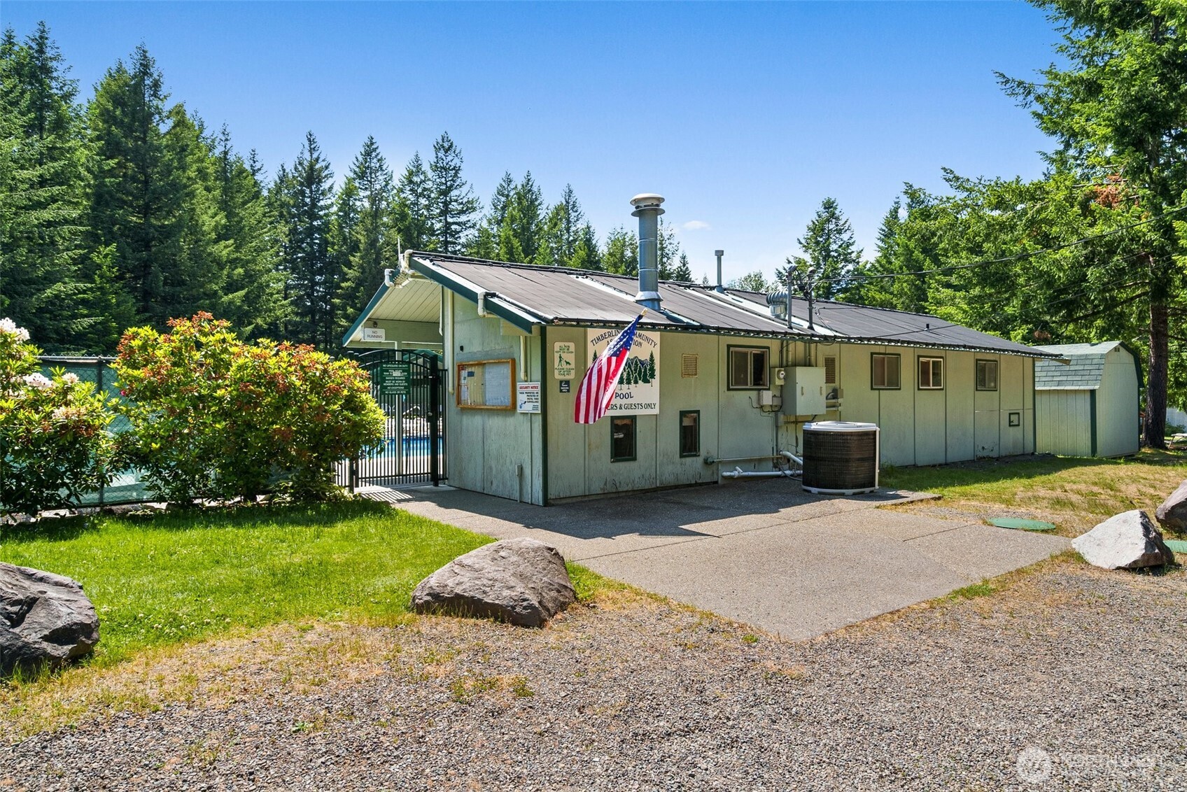 131 Timberline Drive West Packwood, WA 98361 - Photo 24 of 30 a front view of a house with a yard and garage
