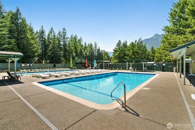 a view of a swimming pool with a patio
