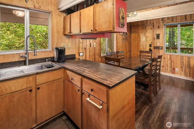 a kitchen with granite countertop a sink and a window