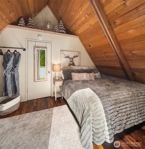 a view of a livingroom with furniture and staircase