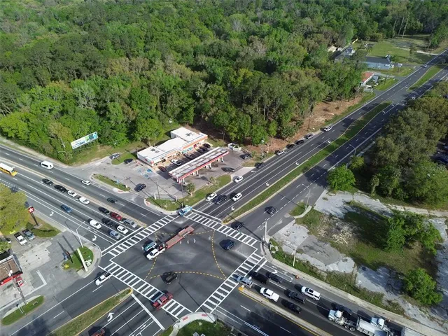 an aerial view of a residential apartment building with a yard