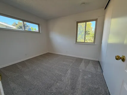 an empty room with windows