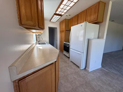 a kitchen with metallic refrigerator freezer and a dishwasher