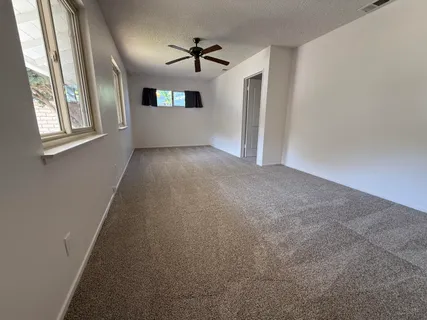 a view of an empty room with a window