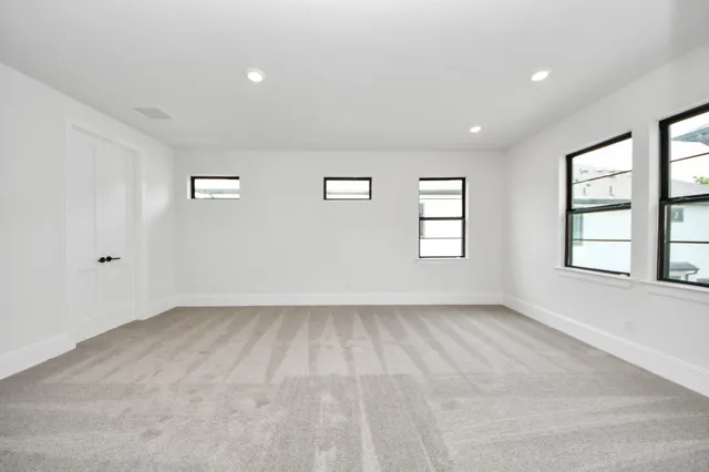 an empty room with windows