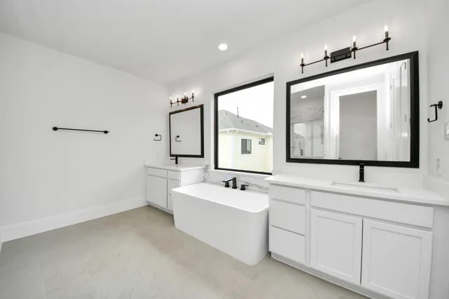 a bathroom with a sink vanity and mirror
