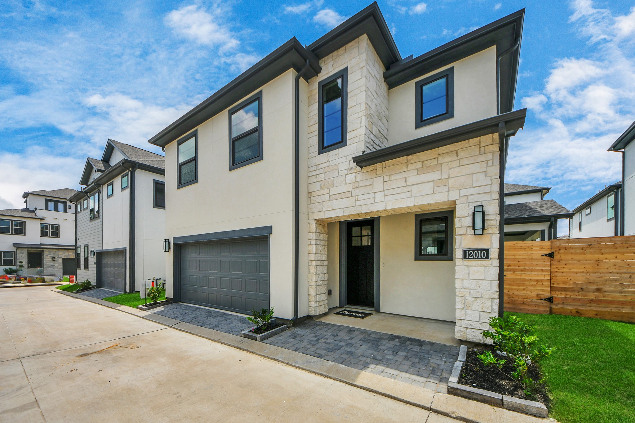12010 Royal Oaks Banner Way Houston, TX 77082 - Photo 2 of 43 a front view of a house with garage