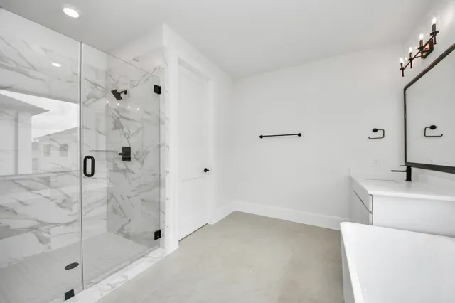 a bathroom with a sink and shower