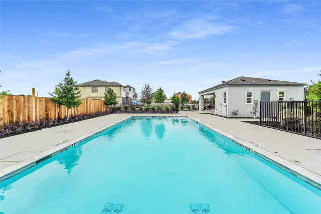 a swimming pool view with a outdoor space