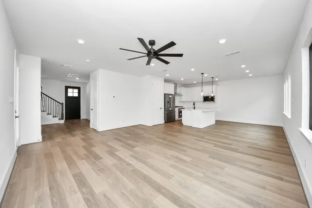 a view of a kitchen with a sink and a stove top oven