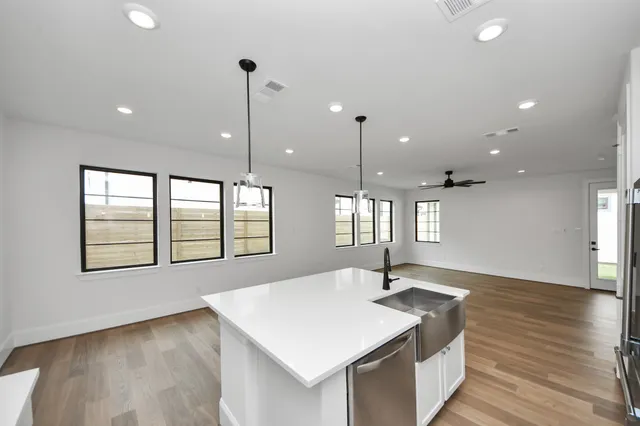 a kitchen with a sink and window