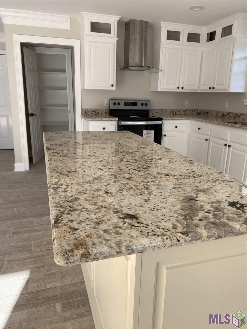 9439 Windward Road Baton Rouge, LA 70810 - Photo 2 of 19 kitchen island