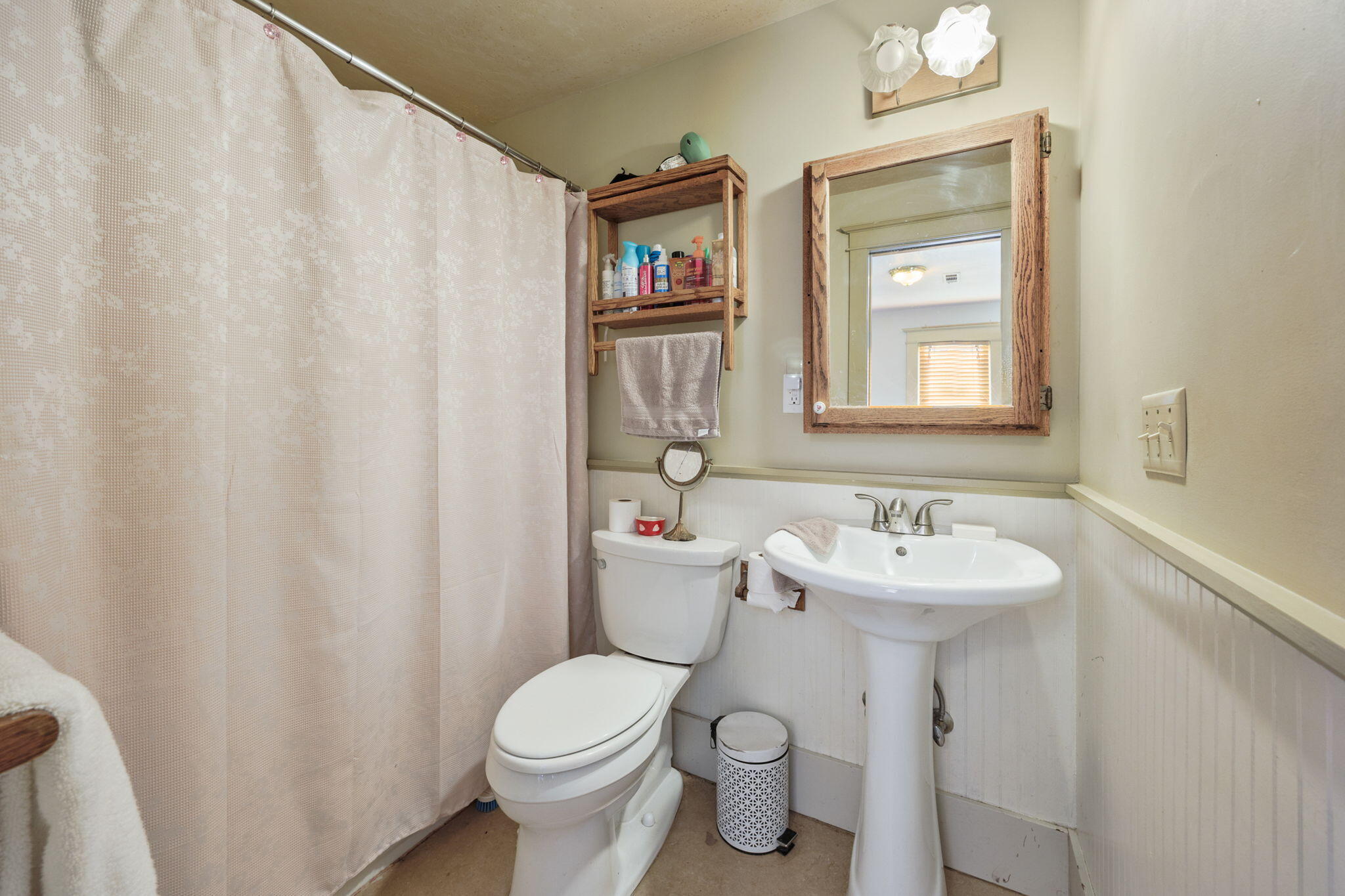75 Wimer Street Ashland, OR 97520 - Photo 29 of 44 a bathroom with a toilet sink and mirror